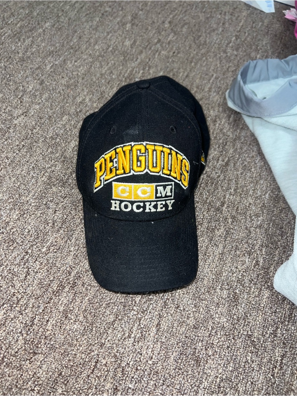 CCM Black Hat with Yellow Penguins Embroidery